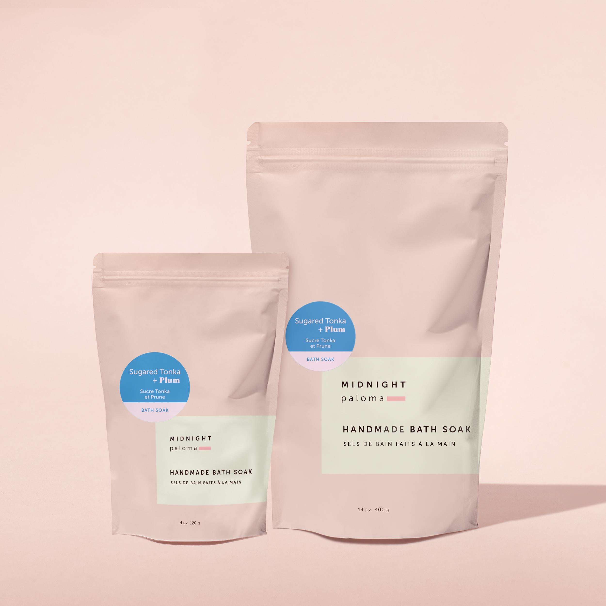 Sugared Tonka + Plum Bath Soak in two resealable pouch sizes. Minimalist label with pastel blue scent sticker. Packaging design by Danielle Gracioso.